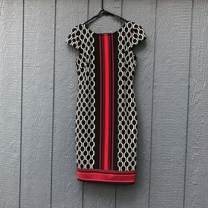 db established 1962 Black white and red dress with cap sleeves.
